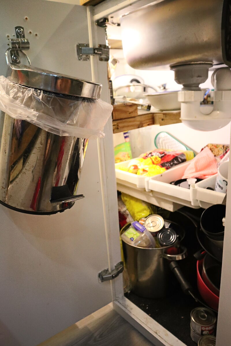 Under sink cupboard with plumbing